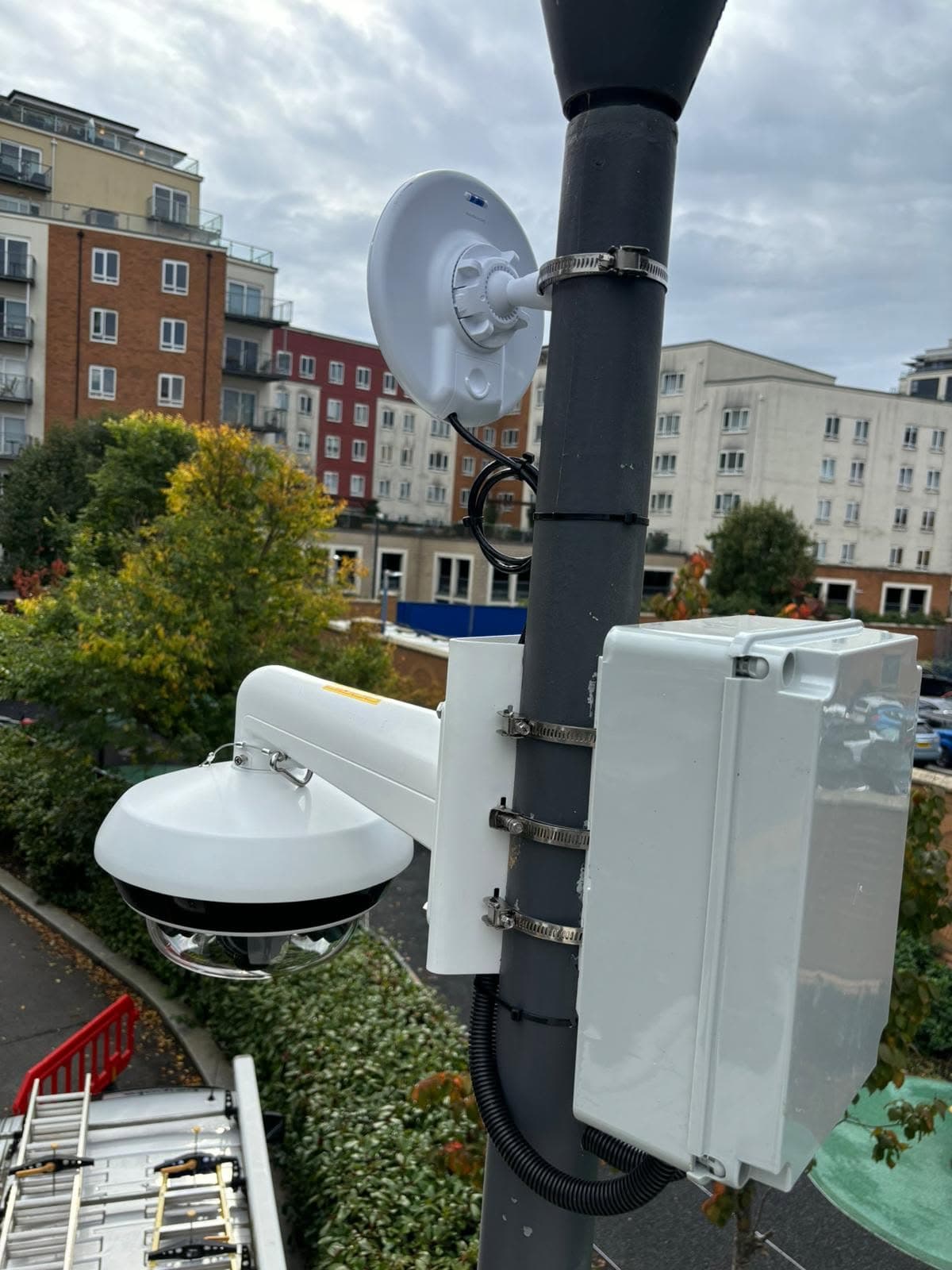 Panoramic CCTV camera and wireless link pole-mounted over a residential car park