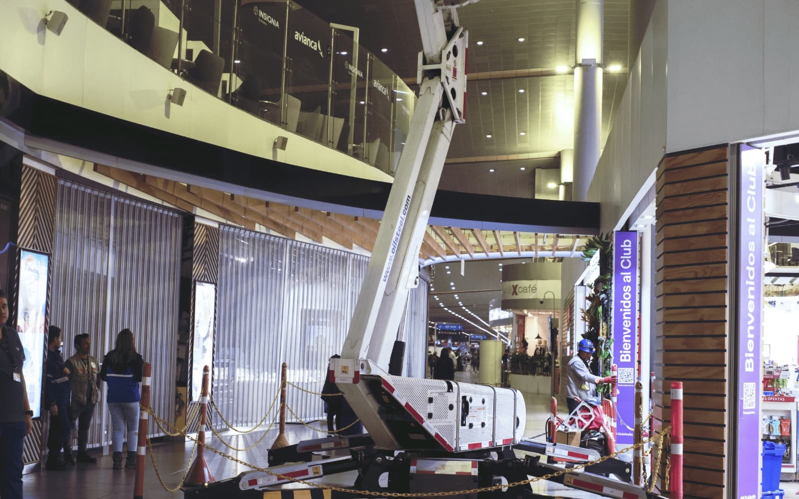 Van-mounted cherry picker extended at height on site
