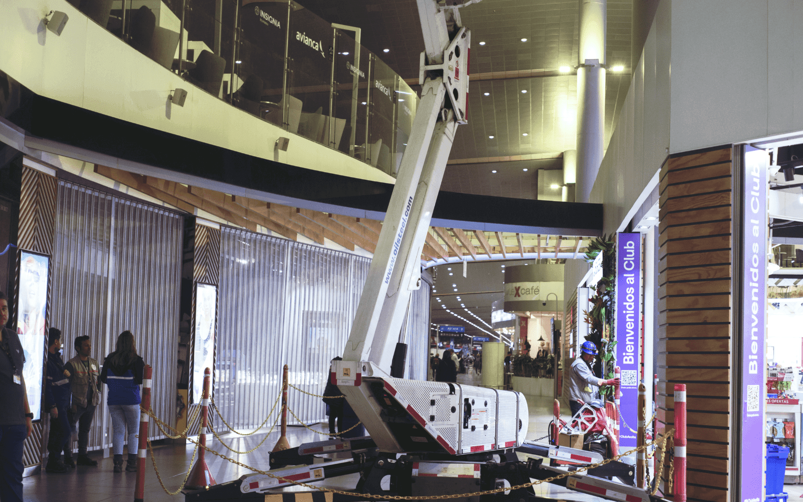 Van-mounted cherry picker extended at height on site