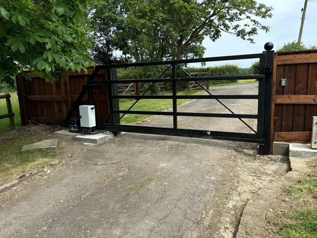 Automated five-bar gate on a rural driveway