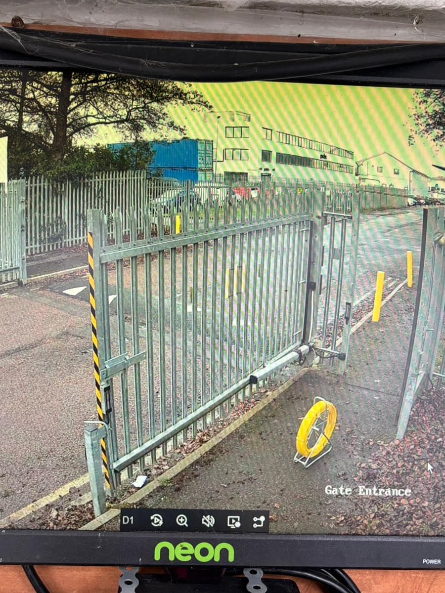 CCTV monitor showing a gate entrance camera feed
