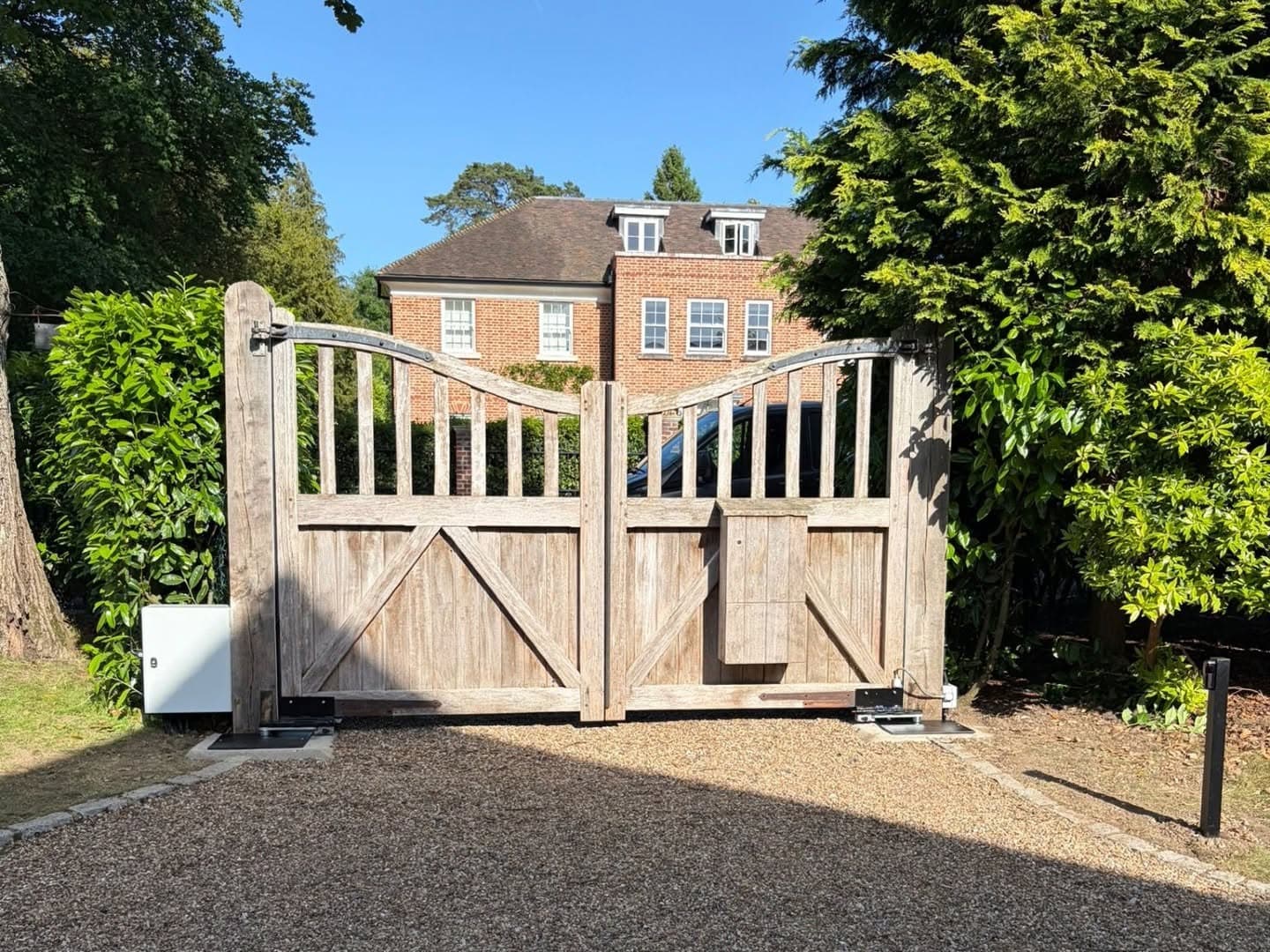 Automated oak driveway gates installed at a Kent country home