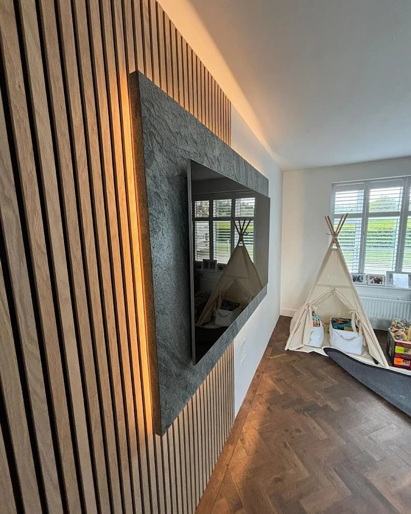 Backlit slatted media wall with recessed TV