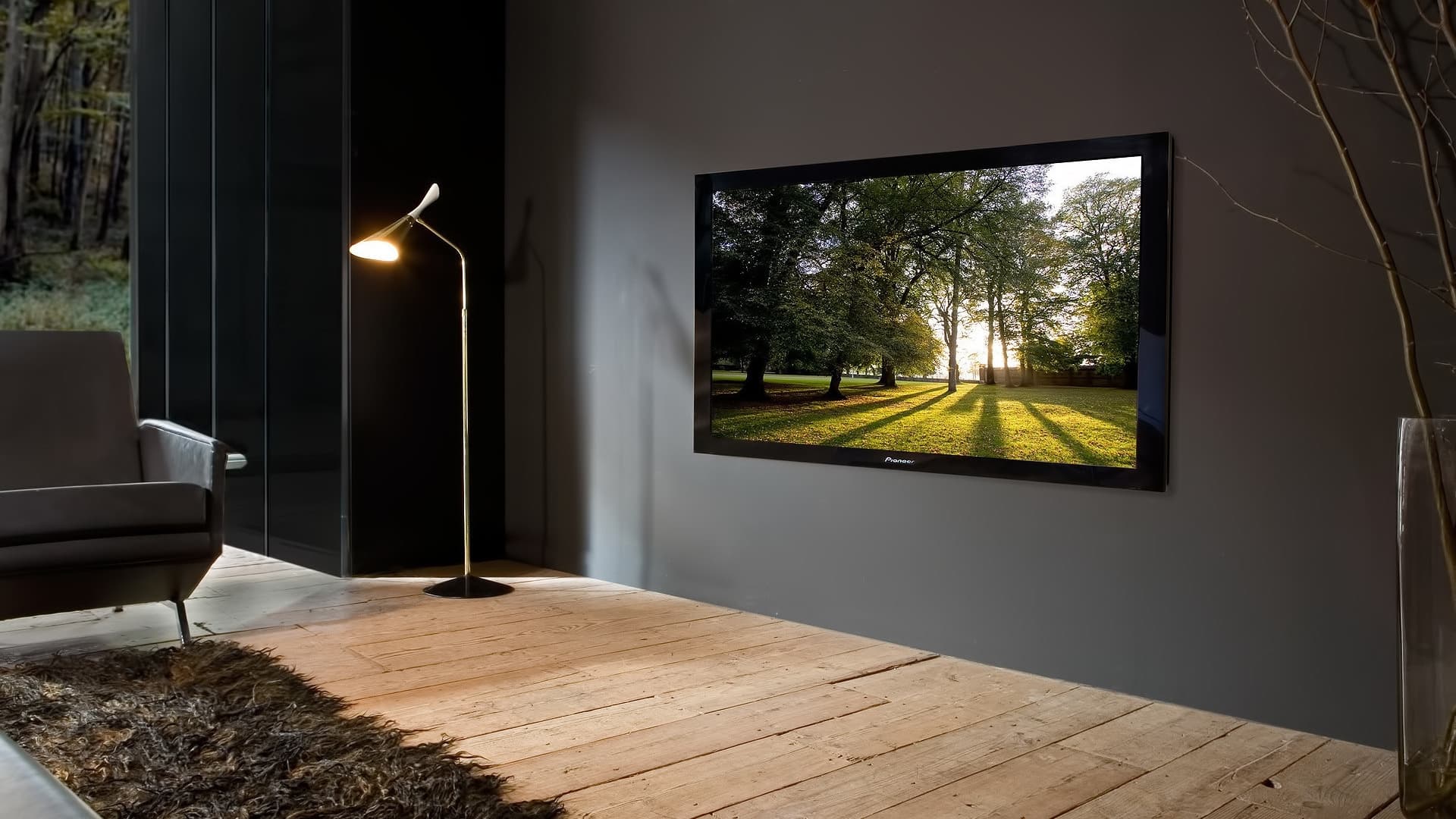 Flat-screen TV mounted flush on a living-room wall